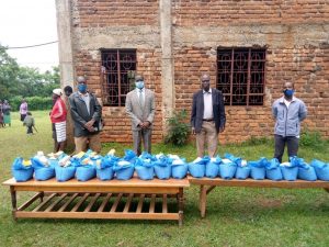 L to R: Pastor Peter, Pastor Edward, Bishop Nicholas and Pastor Kevin distributing virus aid in Ulumbi