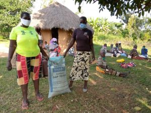 Widows in Sawagongo receiving fertiliser and masks